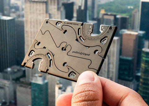 A  Pocket Tripod in card form held over Manhattan 