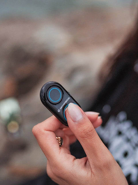 A bluetooth shutter remote being triggered to take a picture or video