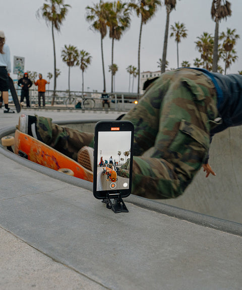 iPhone on the Pocket Tripod at venice beach skatepark capturing a skateboarder land a trick